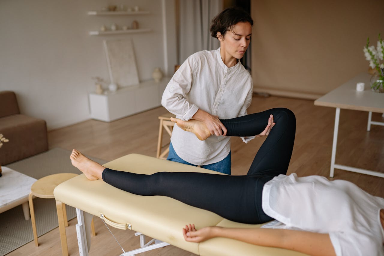 The Benefits of Targeted Pain Management Massage for Chronic Pain Relief - Massage Therapist in Green Bay, WI | RELIEVING MASSAGE A Massage Therapist Massaging the Leg of a Client